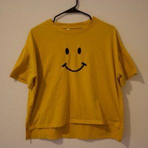 yellow smiley face embodied shirt